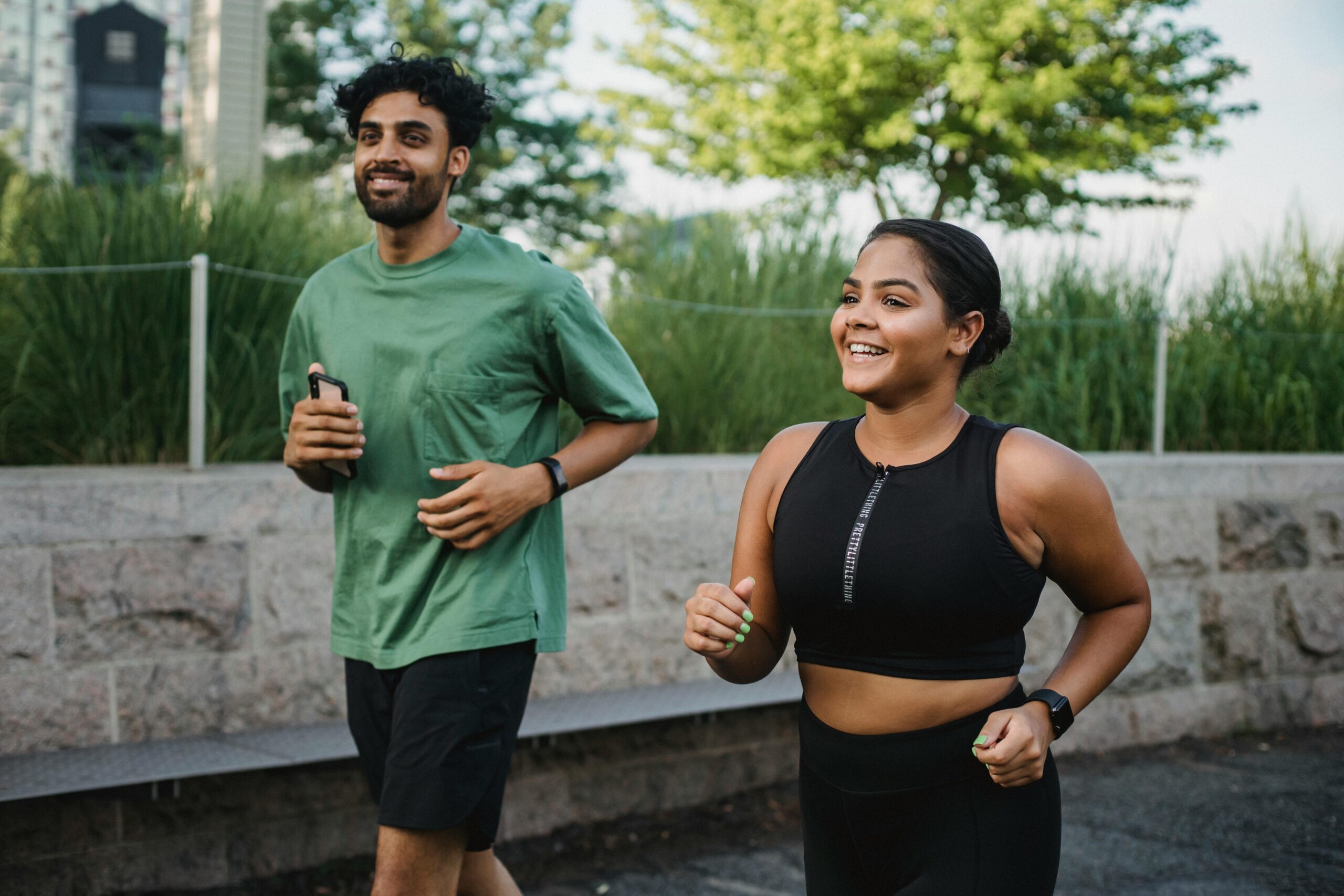 A man and a women are jogging A man and a women are jogging