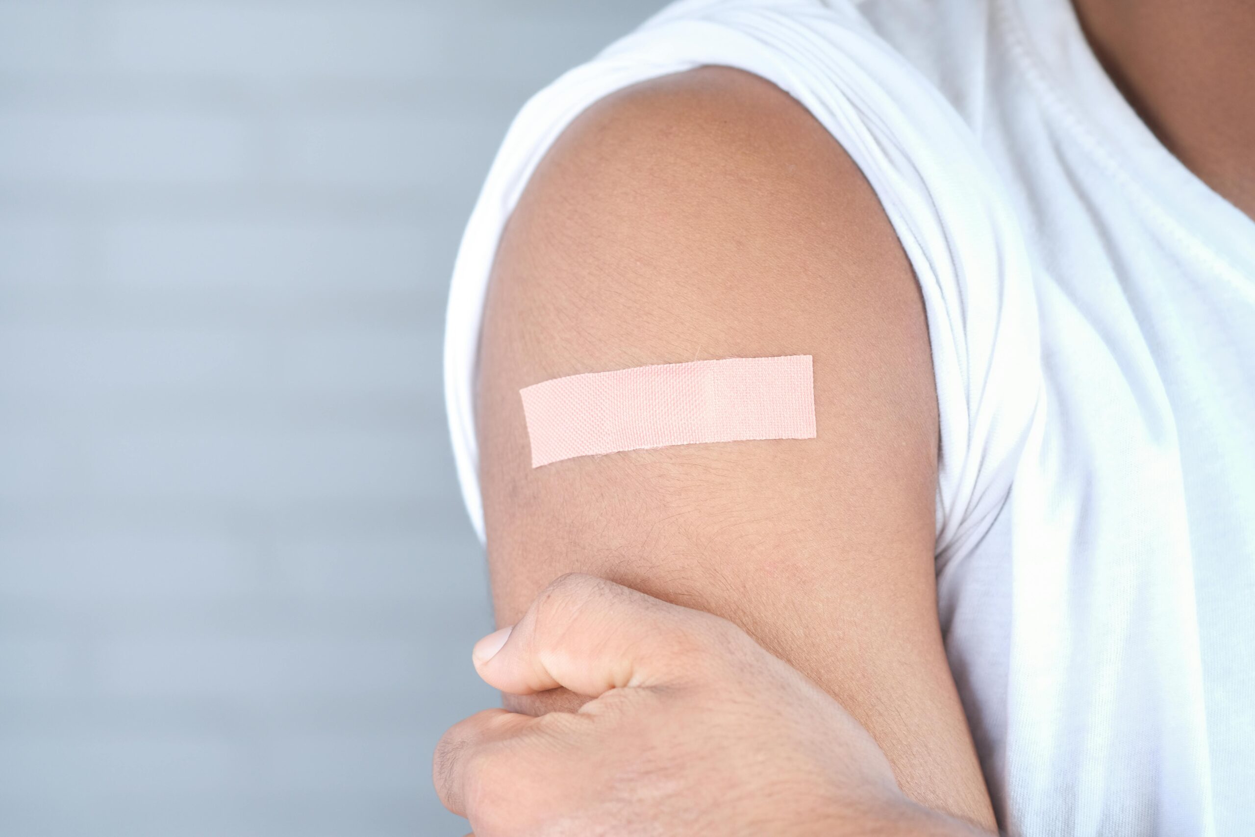 A bandage on arm after injection A bandage on arm after injection
